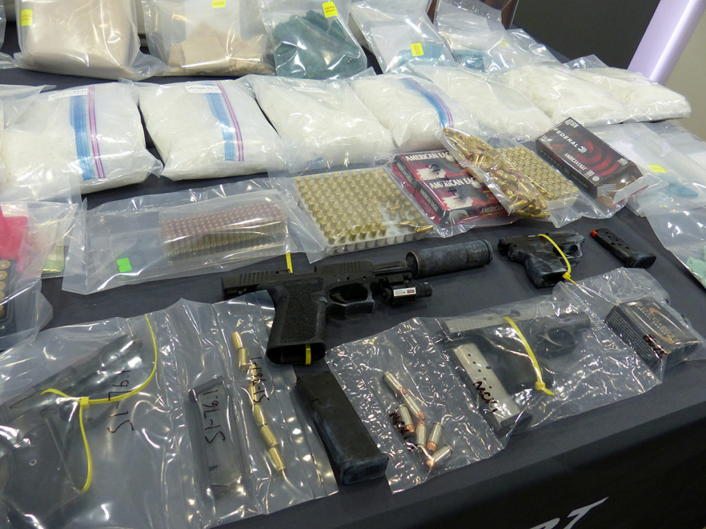 Handguns and drugs seized in million-dollar bust