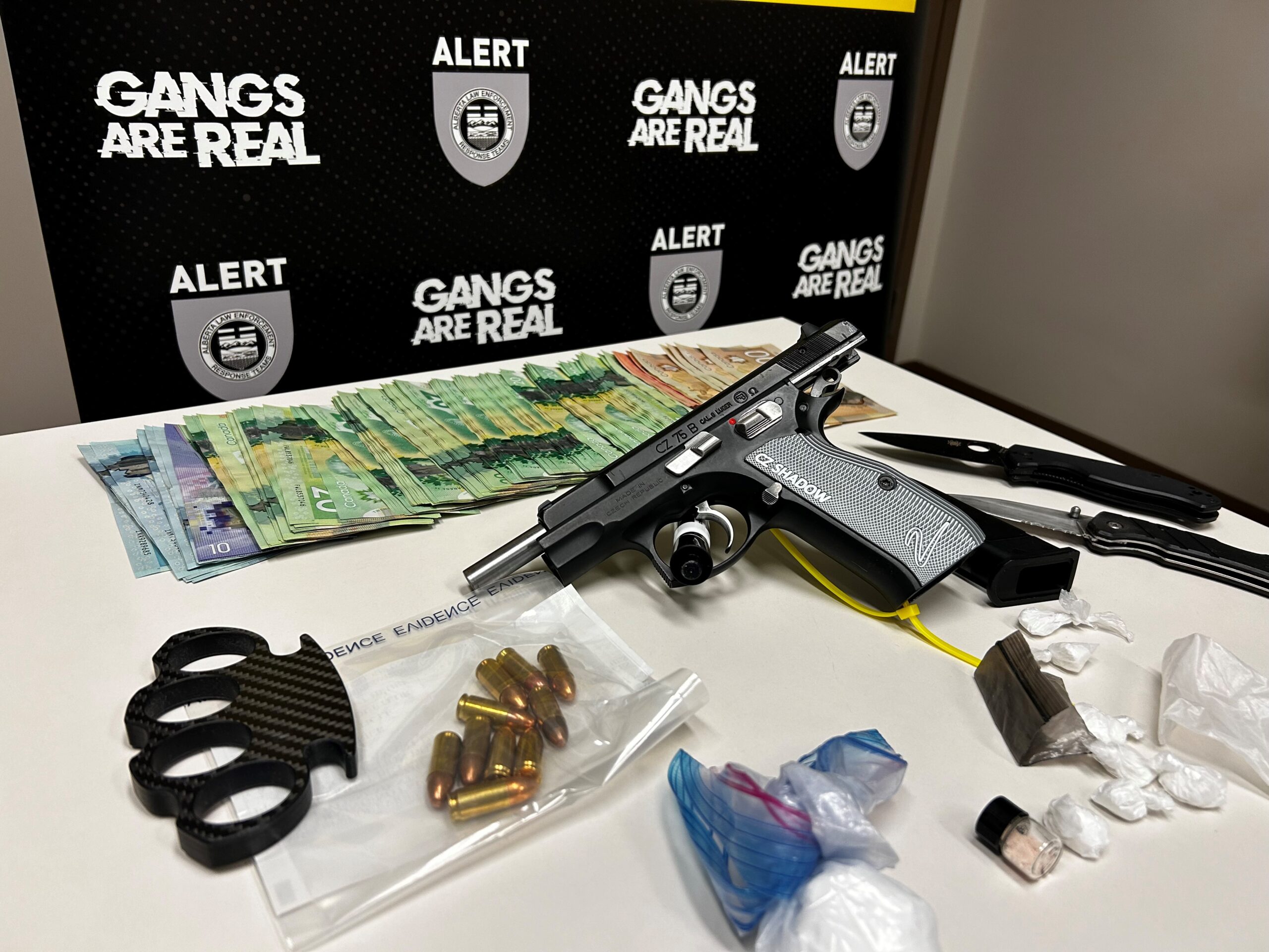Stolen handgun seized during Red Deer arrests